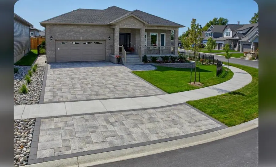 Curved paver driveway and walkway with sunny curb appeal